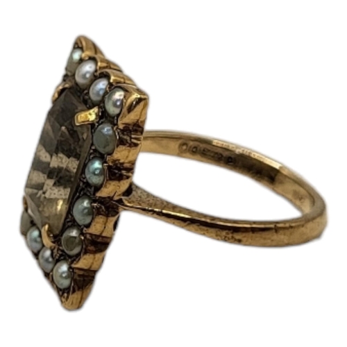 68 - AN EARLY 20TH CENTURY 9CT GOLD, SMOKY QUARTZ AND SEED PEARL RING
The rectangular cut stone,edged wit... 