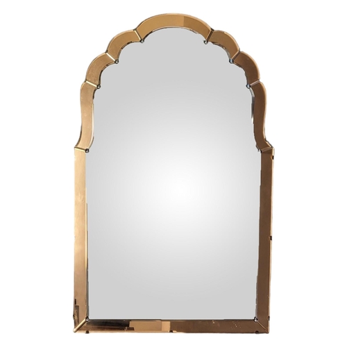 358 - AN ART DECO PEACH GLASS MIRROR
Scrolled form with bevelled silver plate glass.
(approx 56cm x 91cm)
... 