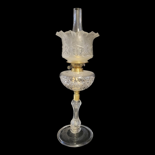 106A - A VICTORIAN CUT GLASS OIL LAMP
Having a fluted frosted glass shade, cut glass well and base.
(approx... 