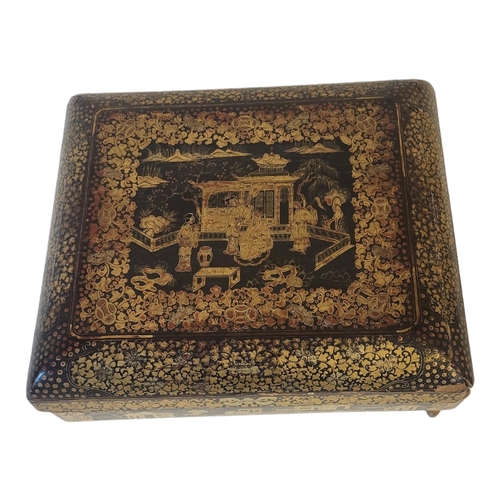 132 - A 19TH CENTURY CHINESE CANTON EXPORT BLACK GILDED LACQUER GAME CARDS BOX AND COVER 
Front cover deco... 