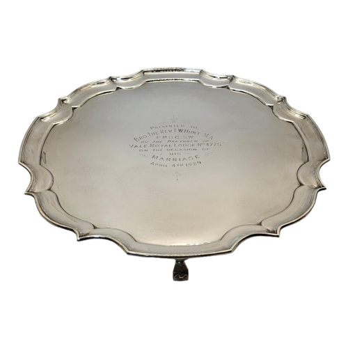 1A - A HALLMARKED SILVER PRESENTATION SALVER WITH PIECRUST BORDER
On four scroll feet, by J. Davis & Son,... 