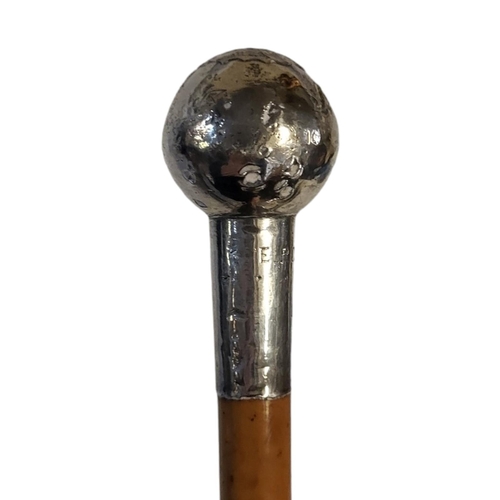 249 - A PRE WAR BRITISH MILITARY OFFICERS SWAGGER STICK
White metal finial with embossed regimental motif ... 