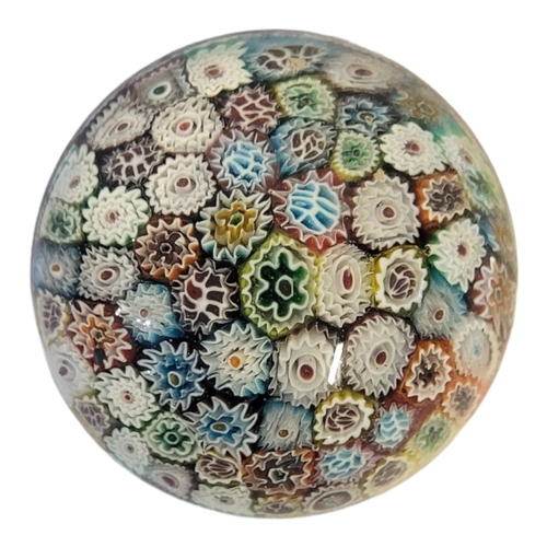 250 - A BACCARAT STYLE CONCENTRIC CLOSE PACK MILLEFIORI PAPERWEIGHT
With a variety of colourful canes.
(di... 