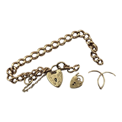 27 - A VINTAGE 9CT GOLD BRACELET 
With double curblinks and a 9ct gold heart form locket, along with a sm... 