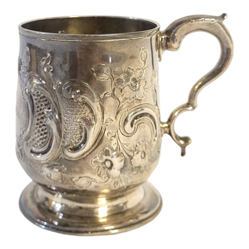 29 - A GEORGE III SOLID SILVER PRESENTATION MUG, LONDON, 1817
Scroll handle, embossed body decoration, en... 