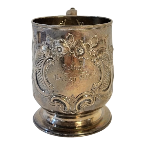 29 - A GEORGE III SOLID SILVER PRESENTATION MUG, LONDON, 1817
Scroll handle, embossed body decoration, en... 