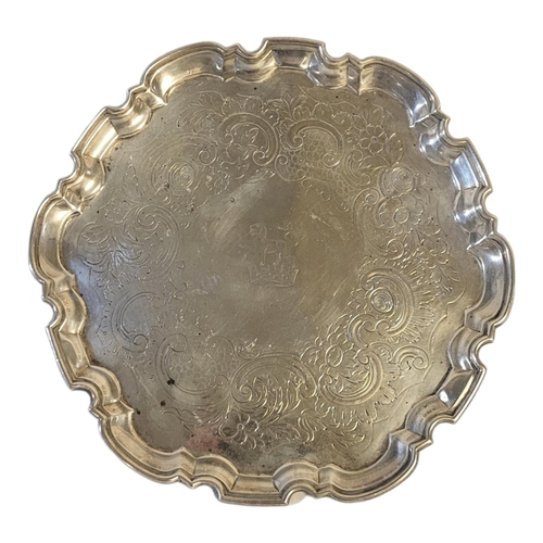 32A - A KING GEORGE II SILVER SALVER
Having a piecrust edge with engraved decoration and family crest, hal... 