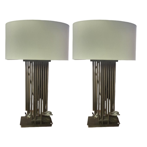 350A - R.V. ASTLEY, A PAIR OF LARGE TWIN BRANCH TABLE LAMPS
Dark patinated brass, with oval cream shades.
(... 