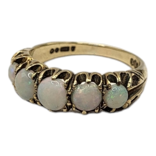 3A - A VINTAGE 9CT OPAL AND DIAMOND FIVE STONE RING
Having a row of round cabochon cut stones.
(size P)

... 