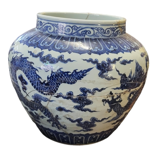 494 - A LARGE CHINESE  BLUE AND WHITE SIGNED MING JARDINIERE, decorated with imperial five toed dragons
44... 