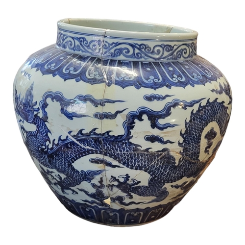 494 - A LARGE CHINESE  BLUE AND WHITE SIGNED MING JARDINIERE, decorated with imperial five toed dragons
44... 