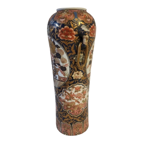 497 - A FINE CHINESE IMARI CYLINDRICAL SHAPED ELEPHANTS TWIN HANDLED VASE
The porcelain body richly enamel... 