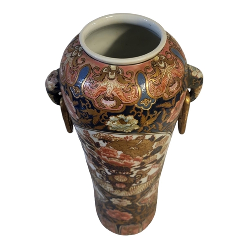 497 - A FINE CHINESE IMARI CYLINDRICAL SHAPED ELEPHANTS TWIN HANDLED VASE
The porcelain body richly enamel... 