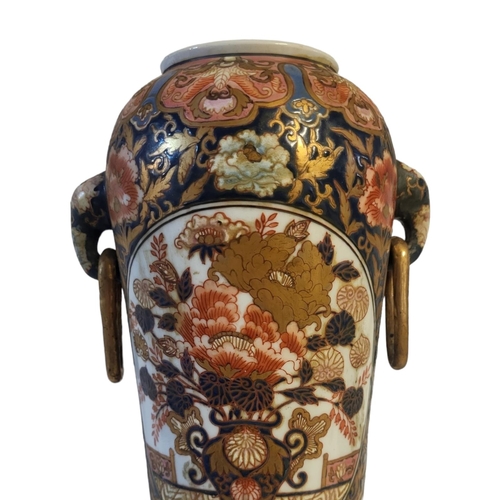 497 - A FINE CHINESE IMARI CYLINDRICAL SHAPED ELEPHANTS TWIN HANDLED VASE
The porcelain body richly enamel... 