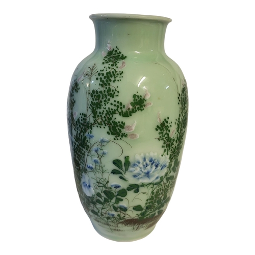 498 - A CHINESE LATE QING DYNASTY CELADON GLAZED BALUSTER VASE
With everted rim applied with raised decora... 