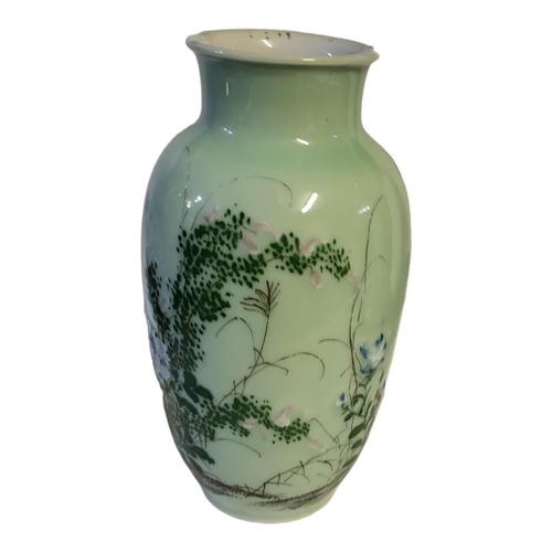 498 - A CHINESE LATE QING DYNASTY CELADON GLAZED BALUSTER VASE
With everted rim applied with raised decora... 