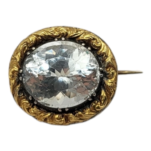 56A - A 19TH CENTURY YELLOW METAL AND AQUAMARINE BROOCH
The single oval faceted pale blue stone,in scrolle... 