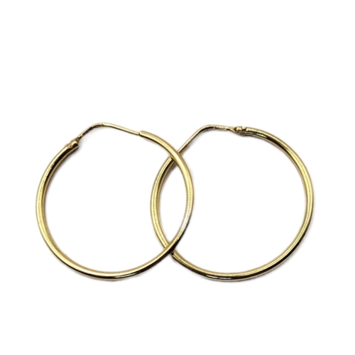 72 - A VINTAGE PAIR OF 18CT GOLD HOOP EARRINGS
Plain form, together with a smaller pair of 9ct earrings a... 
