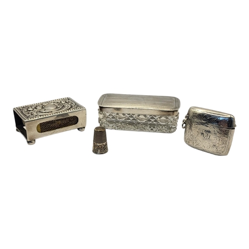 79 - A LATE EDWARDIAN HALLMARKED SILVER VESTA CASE AND HINGED COVER
Birmingham, 1910, partially scroll en... 