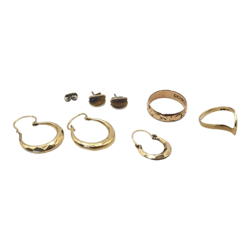 81 - A VINTAGE PAIR OF 9ct GOLD HOOP EARRINGS
Together with a 9ct gold wedding band and a pair of yellow ... 