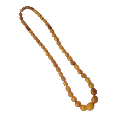 84 - A VICTORIAN BUTTERSCOTCH AMBER BEAD NECKLACE
Having a row of graduated oval beads.
(approx 30cm)

Co... 