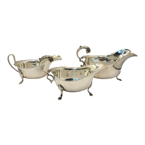 87 - A COLLECTION OF THREE VINTAGE SILVER SAUCE BOATS
Single handles with tripod legs, to include hallmar... 