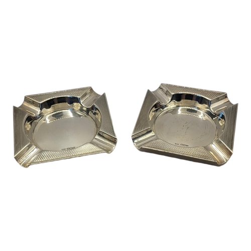 94 - A PAIR OF MID CENTURY SILVER ASHTRAYS
Square form with engraved decoration,hallmarked Sheffield, 194... 