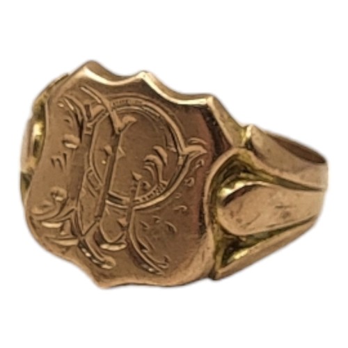 83A - AN EDWARDIAN 9CT GOLD GENT’S SIGNET RING
Having a shield finial and engraved initials.
(size R)

Con... 