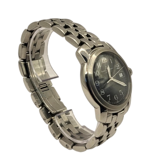 96 - BAUME AND MERCIER, A STAINLESS STEEL GENT’S WRISTWATCH
The circular black dial with steel arabic num... 