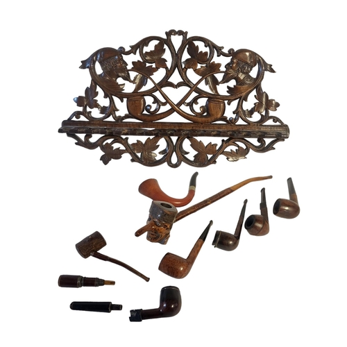 316A - A 19TH CENTURY 'BLACK FOREST' CARVED OAK TOBACCO PIPE RACK
Opposing digital carved heads with pierce... 