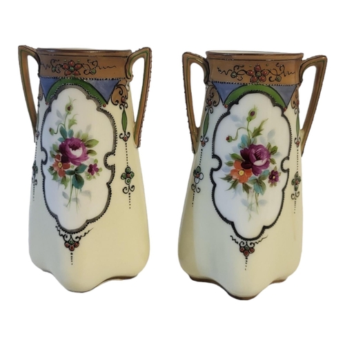 327A - NORITAKE, A PAIR OF EARLY 20TH CENTURY JAPANESE PORCELAIN VASE
Twin handled with hand painted decora... 