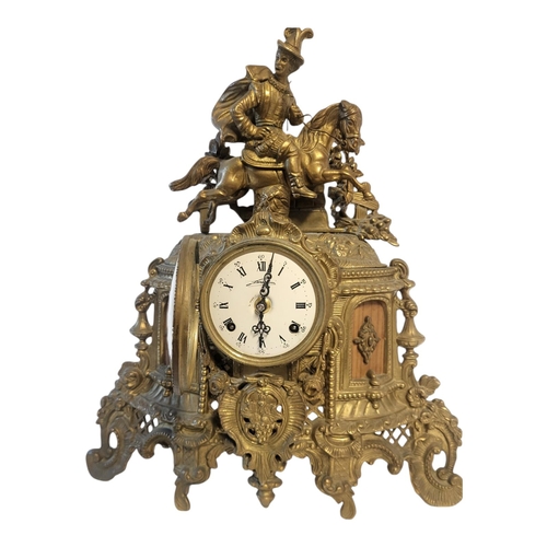 107 - A 20TH CENTURY BRASS FIGURAL MANTLE CLOCK
A Tudor equestrian figure on a scrolled and pierced case, ... 