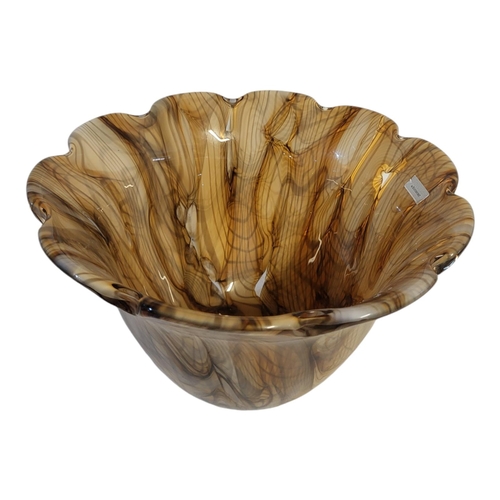 111 - WATERFORD, A LARGE COLOURED GLASS BOWL
Having a scalloped edge with mottled beige effect, engraved m... 