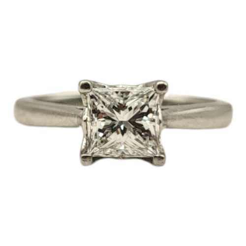 11A - AN 18CT WHITE GOLD AND PRINCESS CUT DIAMOND SOLITAIRE RING
The single stone of plain design, marked ... 