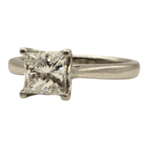 11A - AN 18CT WHITE GOLD AND PRINCESS CUT DIAMOND SOLITAIRE RING
The single stone of plain design, marked ... 