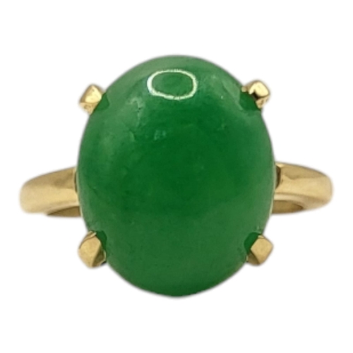 12A - AN 18CT GOLD AND JADE RING
Cabochon cut and untreated jade stone.
(approx 1.2cm x 1.5cm, size M/N)

... 