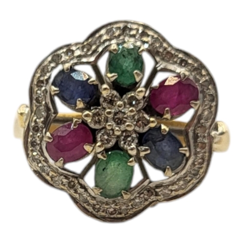 13A - AN 18CT GOLD, DIAMOND AND MULTI GEM SET CLUSTER RING
Having an arrangement of oval cut rubies, sapph... 