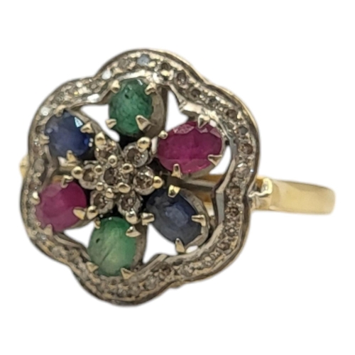 13A - AN 18CT GOLD, DIAMOND AND MULTI GEM SET CLUSTER RING
Having an arrangement of oval cut rubies, sapph... 