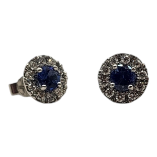 18A - AN 18CT WHITE GOLD ,SAPPHIRE AND DIAMOND CLUSTER EARRINGS
The central round cut sapphire edged with ... 