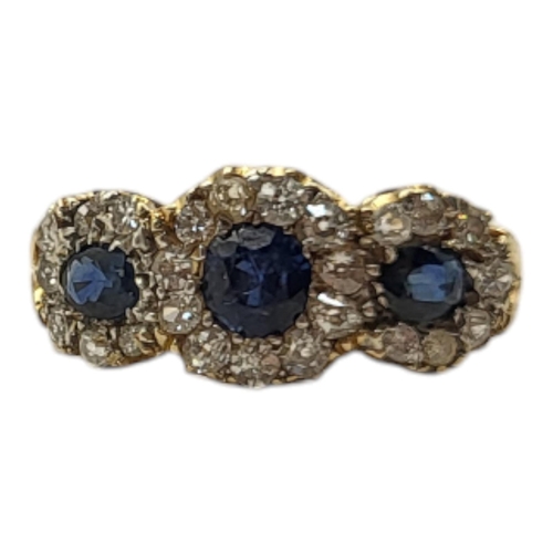 20A - A VINTAGE YELLOW METAL SAPPHIRE AND DIAMOND CLUSTER RING
The oval and round cut sapphires edged in d... 