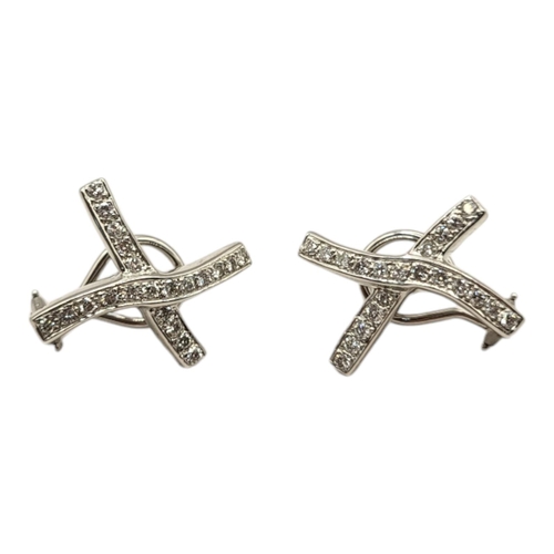 21A - A PAIR OF WHITE GOLD AND DIAMOND ‘KISS’ EARRINGS
Each having two rows of diamonds.
(approx 2cm x 1.5... 