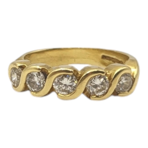 22A - AN 18CT GOLD FIVE STONE DIAMOND RING
Having a row of round cut diamonds.
(approx total diamond weigh... 