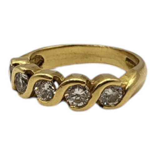 22A - AN 18CT GOLD FIVE STONE DIAMOND RING
Having a row of round cut diamonds.
(approx total diamond weigh... 