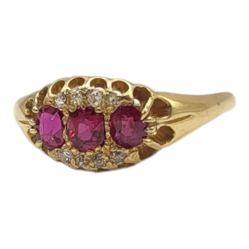 23A - AN EARLY 20TH CENTURY RUBY THREE STONE RING
Set with three oval cut stones edged with diamonds.
(siz... 