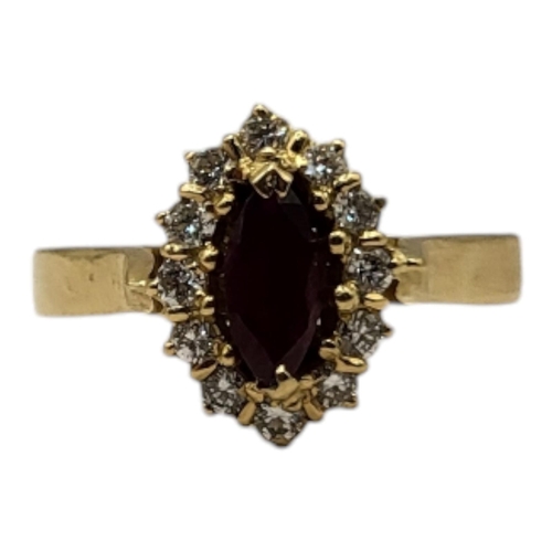 24A - AN 18CT GOLD, RUBY AND DIAMOND CLUSTER RING
The marquise cut ruby edged with diamonds.
(approx ruby ... 