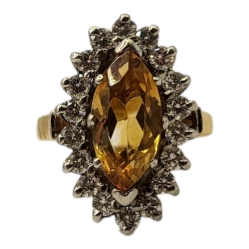 26A - AN 18CT GOLD CITRINE AND DIAMOND RING
Set with a marquise cut citrine edged with round cut diamonds.... 