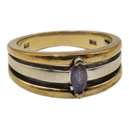 29 - A BICOLOUR 9CT GOLD AND TANZANITE RING
The marquis cut stone in white and yellow gold band.
(size M)... 