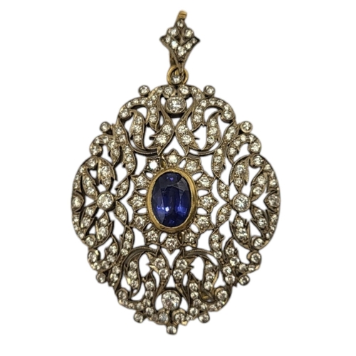 2A - AN 18CT GOLD DIAMOND AND SAPPHIRE PENDANT BROOCH
The oval cut sapphire in a multi diamond pierced de... 