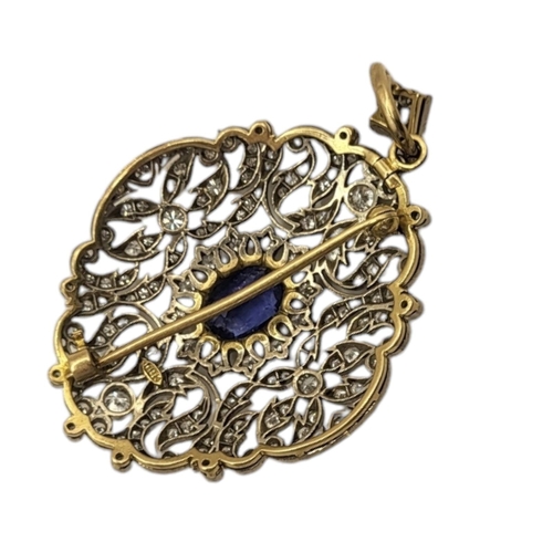 2A - AN 18CT GOLD DIAMOND AND SAPPHIRE PENDANT BROOCH
The oval cut sapphire in a multi diamond pierced de... 