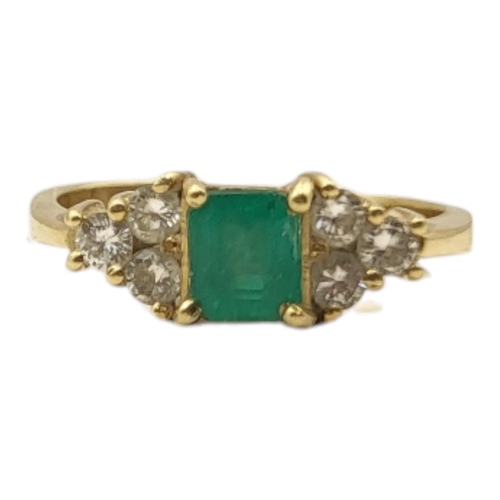 3A - AN 18CT GOLD, EMERALD AND DIAMOND RING
The central square cut emerald edged with round cut diamonds.... 